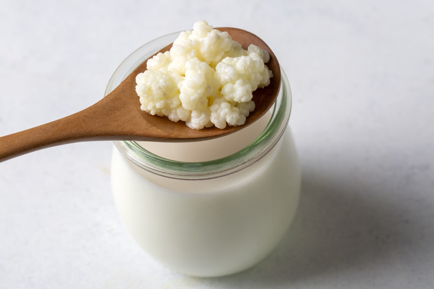 A wooden spoon with kefir