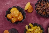 bowls of dried raisins and apricots