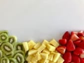 piles of kiwi, pineapple, and strawberry