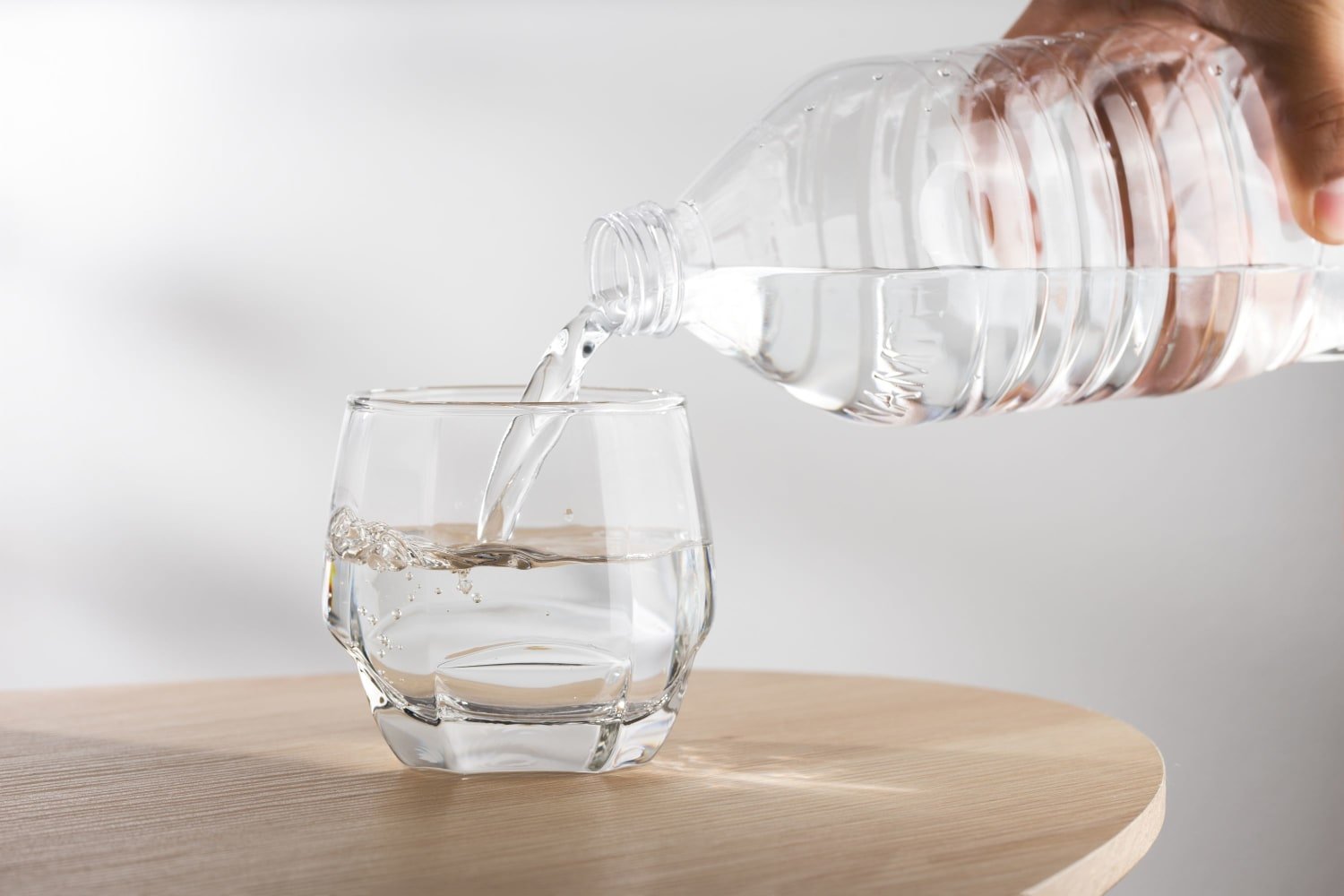 Pouring water into a glass