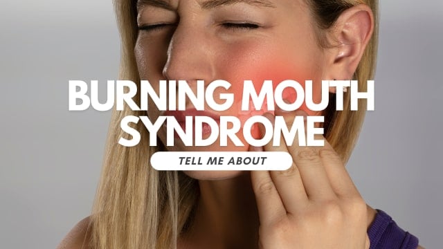 woman holding jaw in pain. 